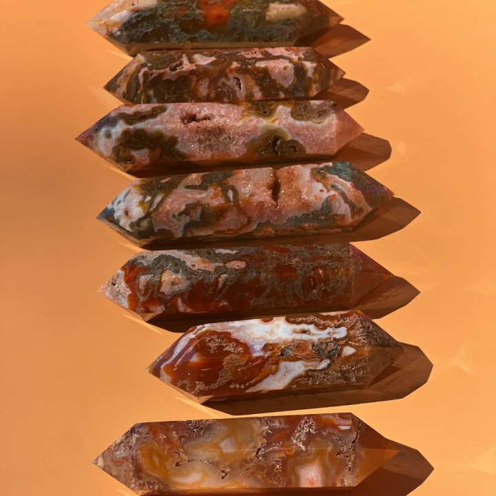 7 red moss agate on an orange background