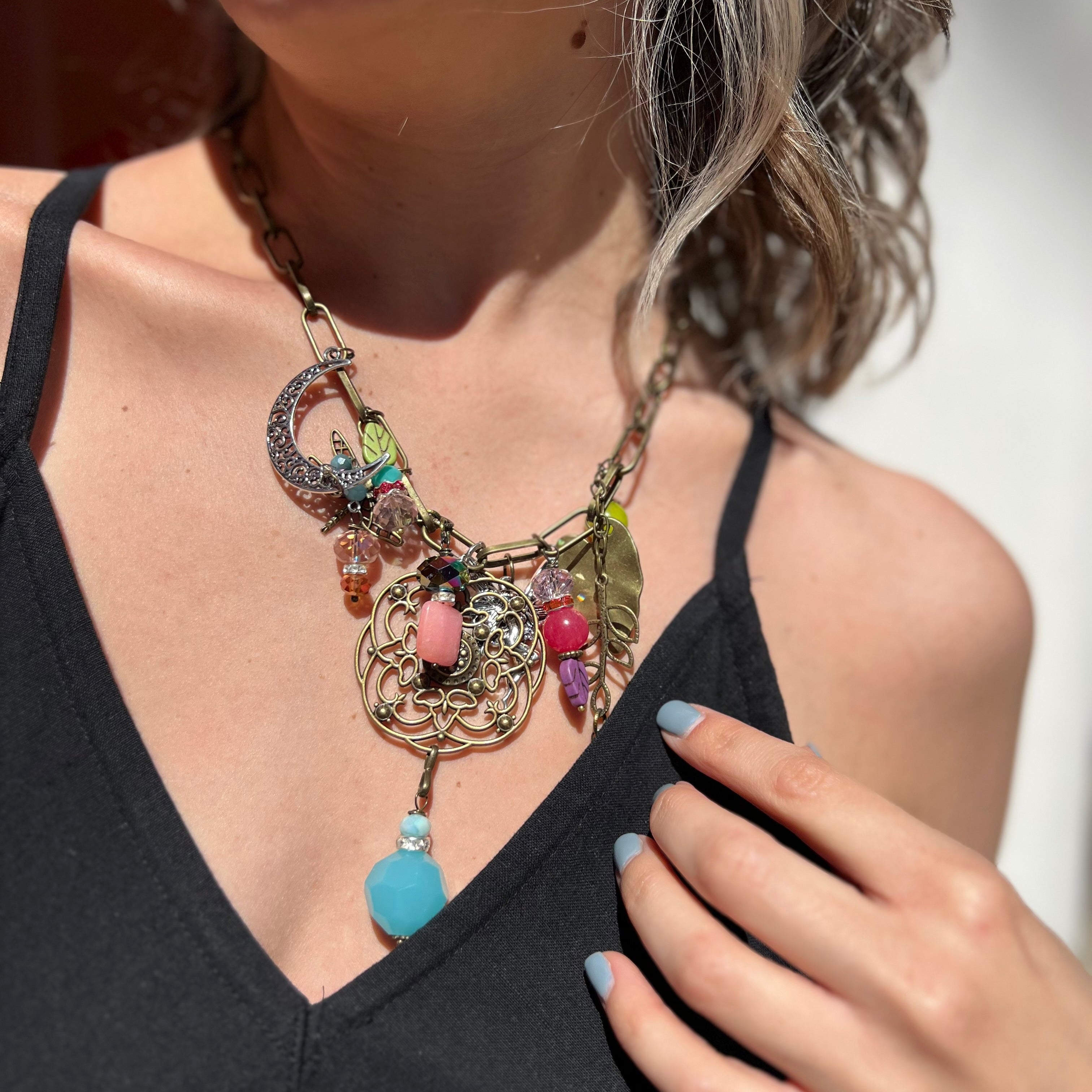 A woman wearing the Gypsy Junk Original Bright 24" Necklace with a black dress.