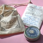 The contents of the Easy Sleep Gift Set lying on a pink background.