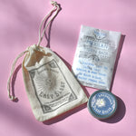 The contents of the Easy Sleep Gift Set lying on a pink background.