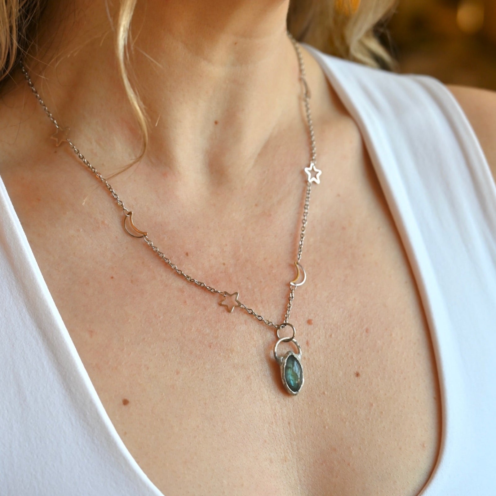 Someone wearing the Labradorite Sterling Silver Celestial Necklace.