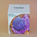 The Amethyst Crystal Bath Bomb on a pink background.