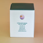 The side of the box of the Hand-Painted Lavender Bath Bomb on a dusty pink background.