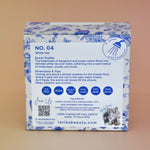 The back of the White Tea Shower Steamers - 4 Pack Shower Steamers on a pink background.