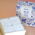 The White Tea Shower Steamers - 4 Pack Shower Steamers on a pink background.