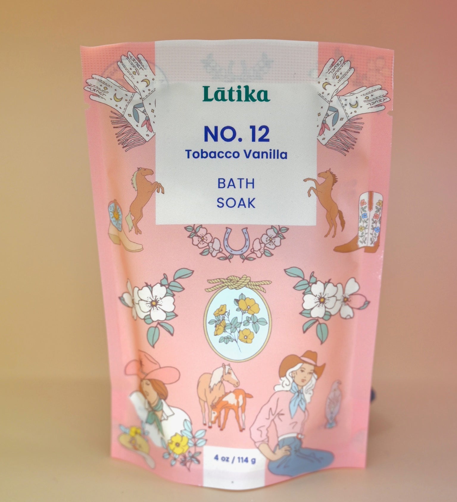 The Tobacco-Vanilla Vegan Bath Soak on a dusty pink background.