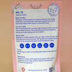 The back of the Tobacco-Vanilla Vegan Bath Soak on a dusty pink background.