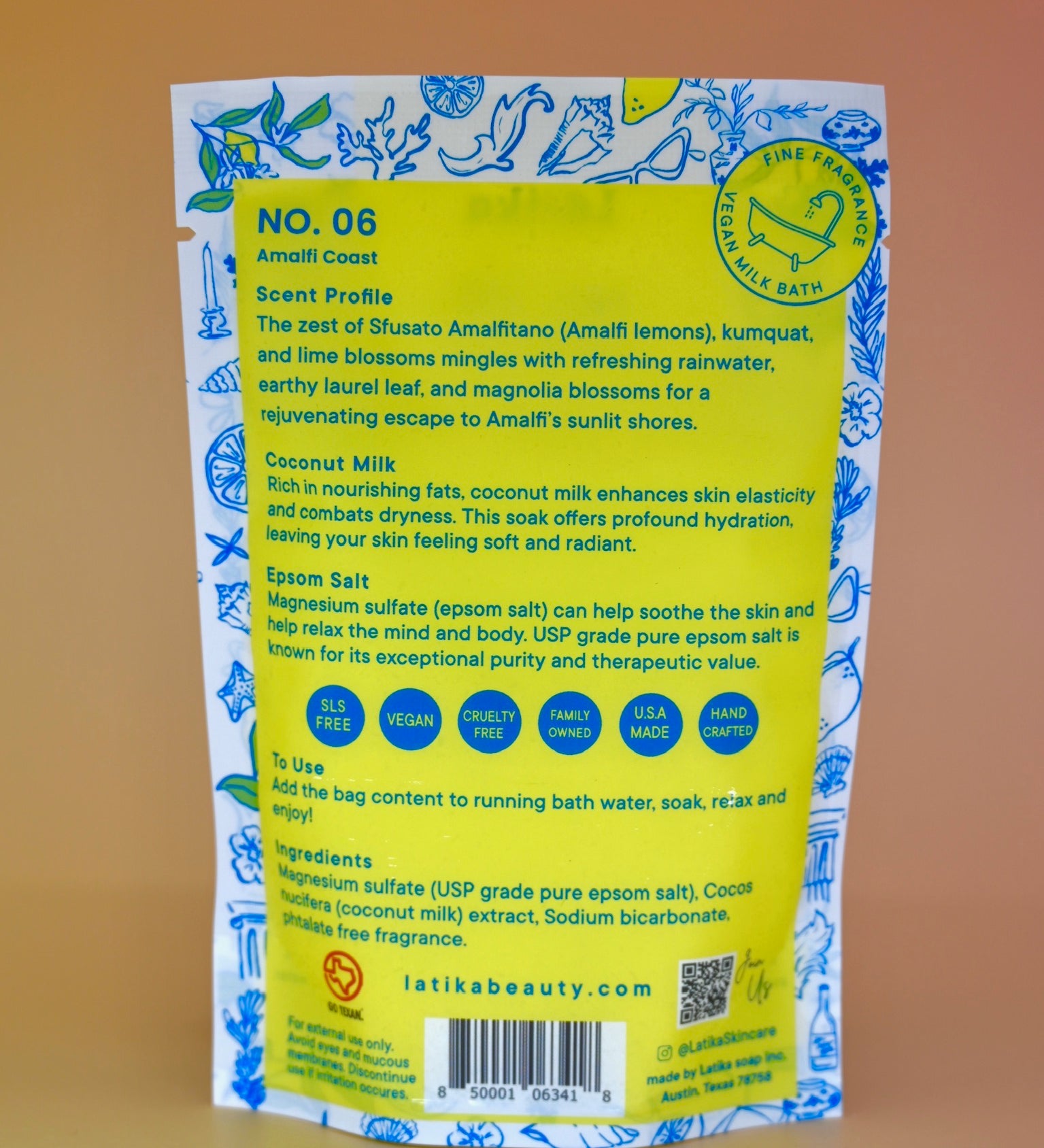 The back of the Amalfi Coast Vegan Milk Bath Soak on a dusty pink background.