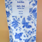 The White Tea Milk Bath Soak on a dusty pink background.