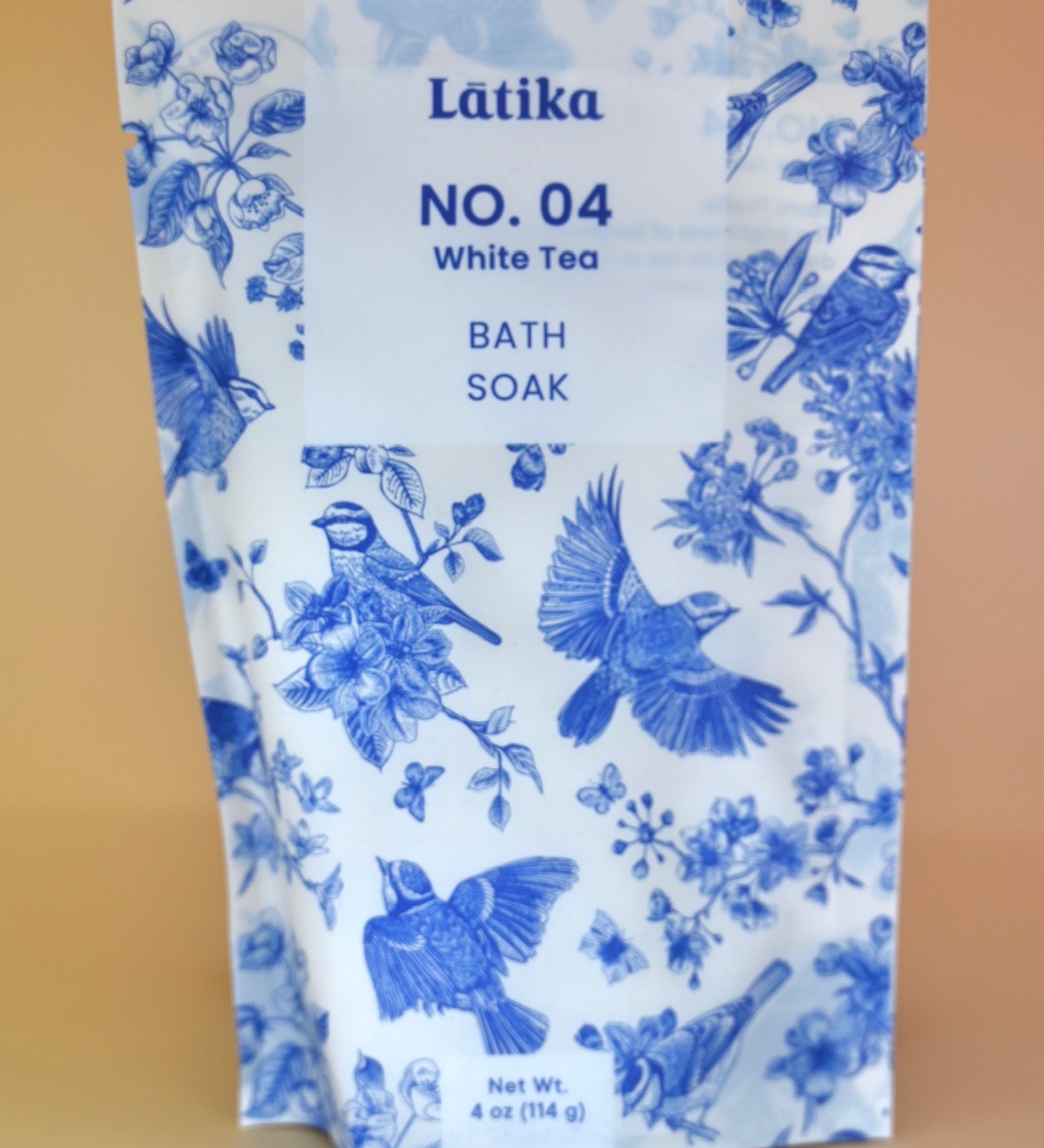 The White Tea Milk Bath Soak on a dusty pink background.