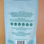 The back of the Melatonin Bath Soak for Sleep Assist on a dusty pink background.