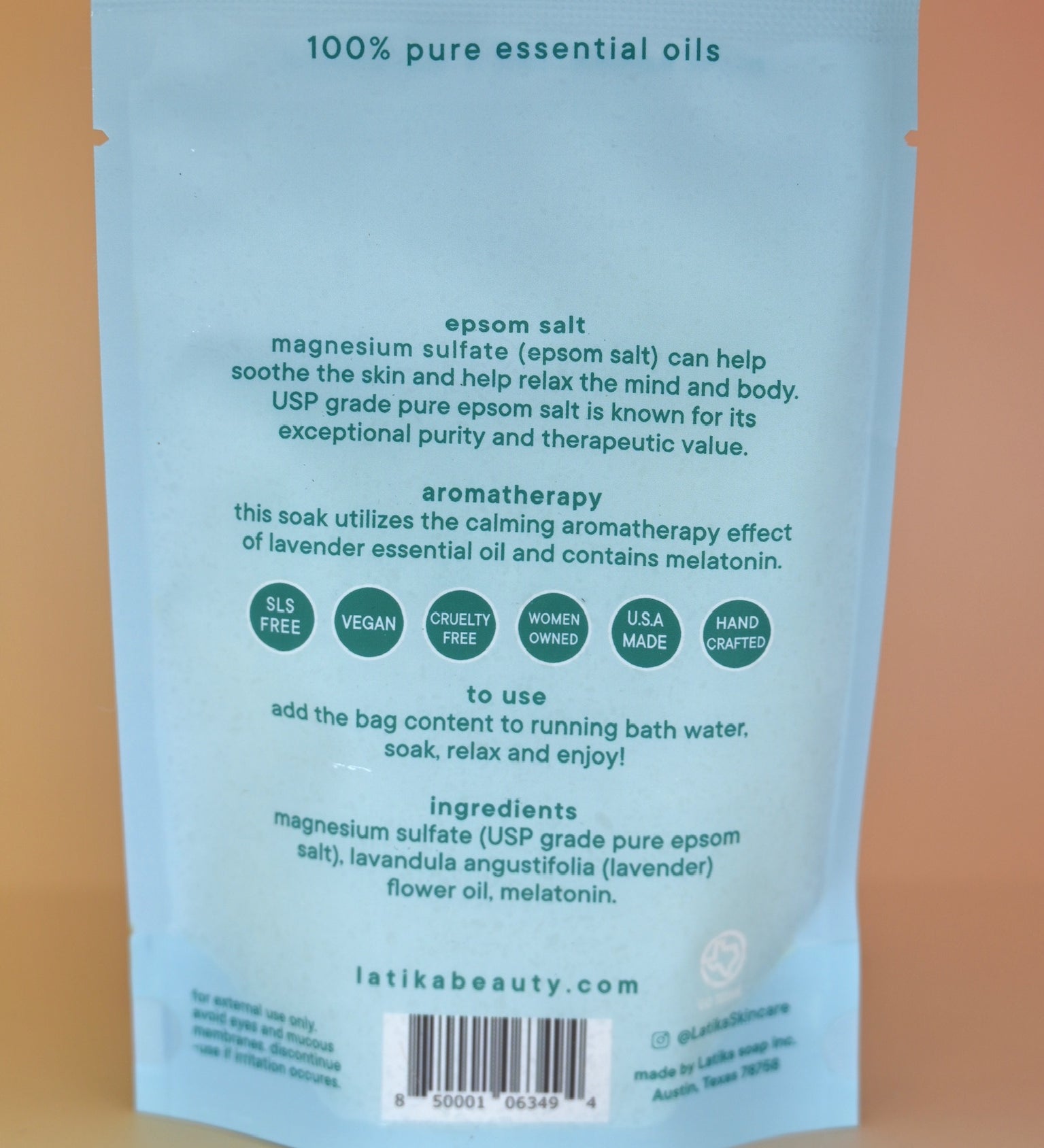 The back of the Melatonin Bath Soak for Sleep Assist on a dusty pink background.