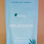 The Melatonin Bath Soak for Sleep Assist on a dusty pink background.