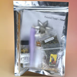 The back of the Personal Power Ritual and Bottle Spell Amulet Kit on a pink and yellow background.
