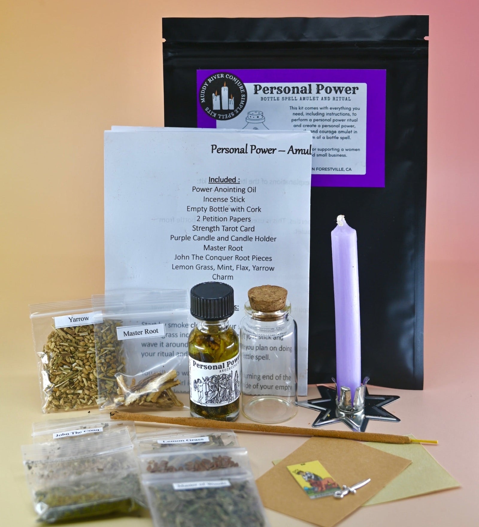 The Personal Power Ritual and Bottle Spell Amulet Kit on a pink and yellow background with all its contents out as well.