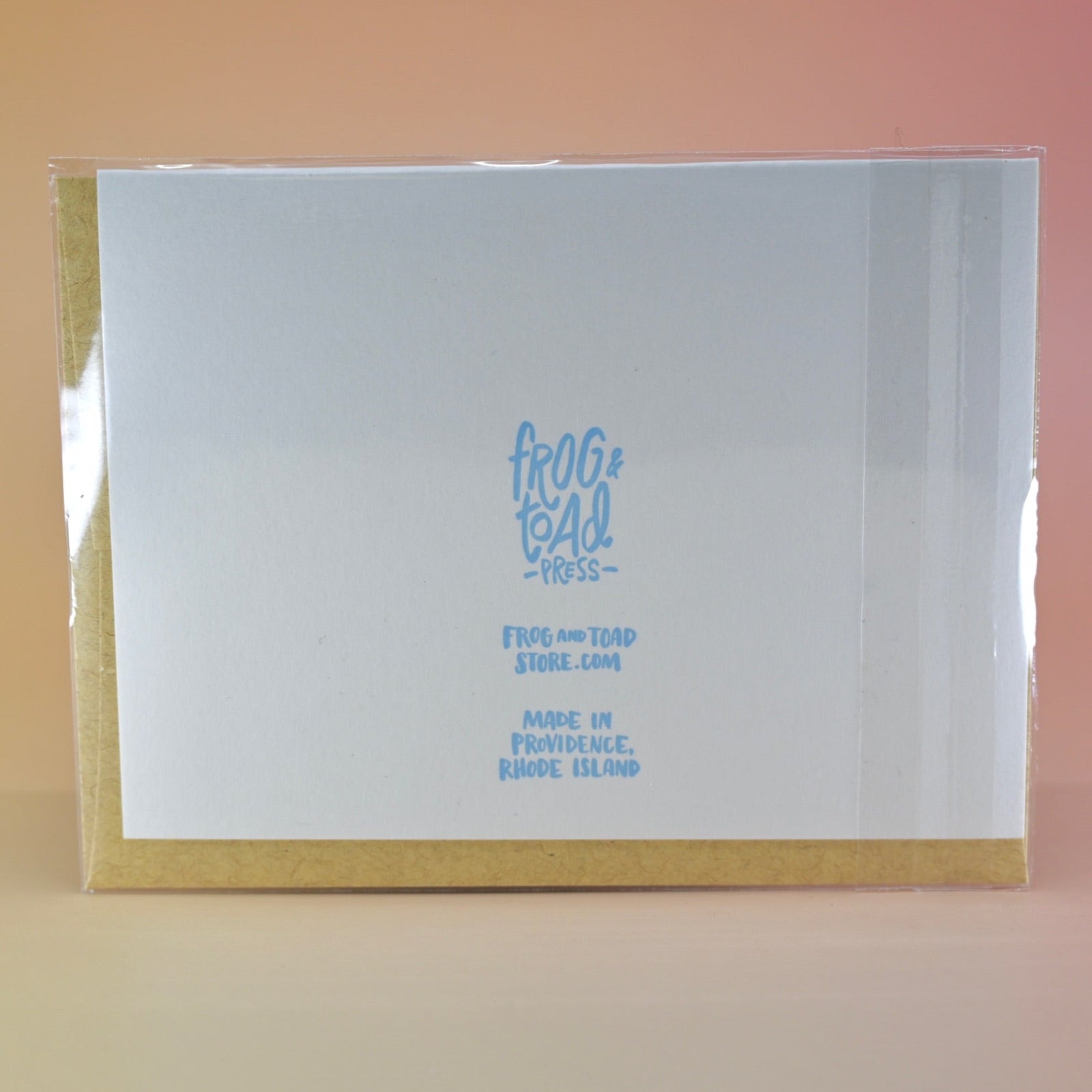 The back of the Mom Fact #46 Pregnancy Congratulations Greeting Card on a peach colored background.