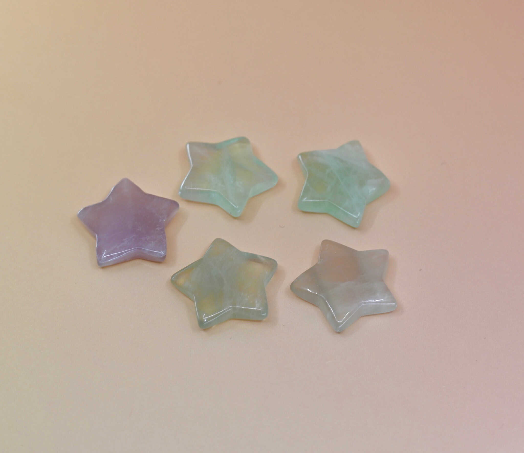 Crystal Gemstone Stars on pale orange background