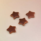 Crystal Gemstone Stars on pale orange background