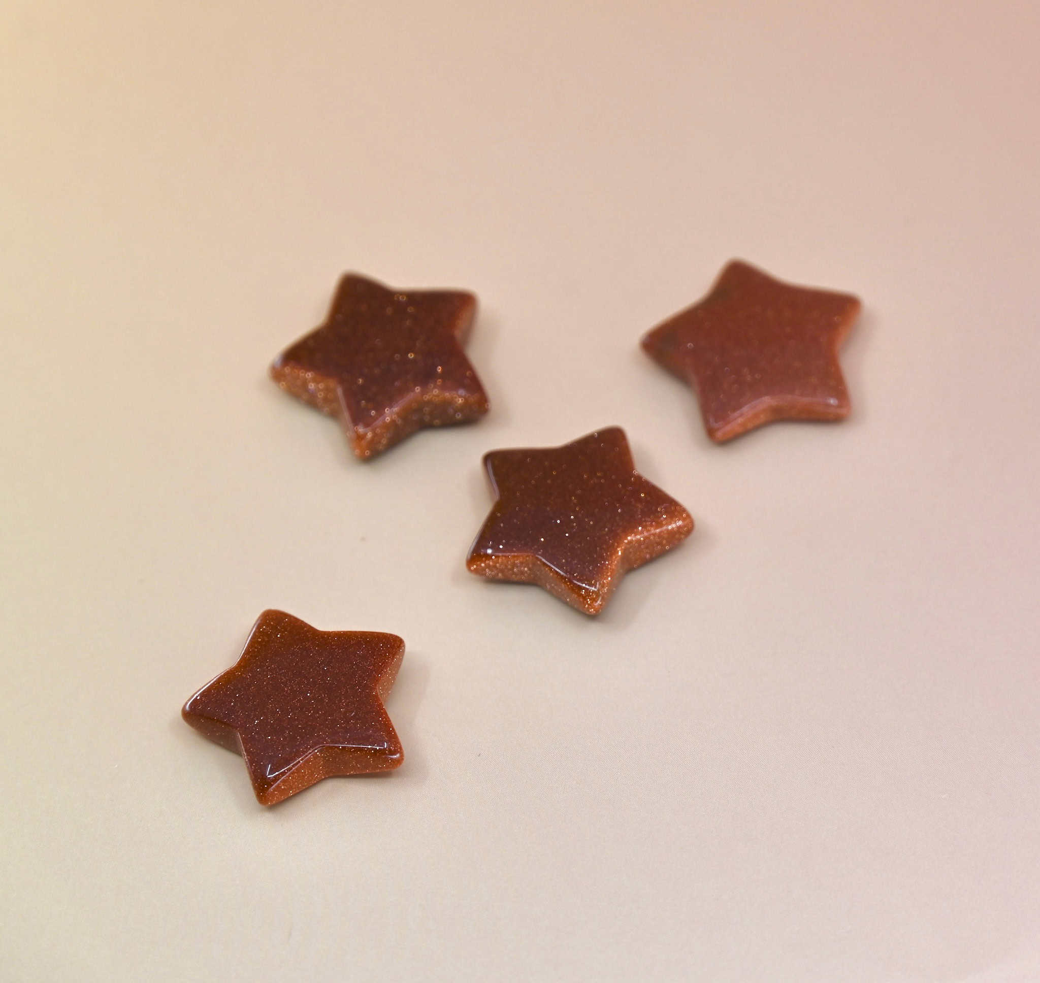 Crystal Gemstone Stars on pale orange background