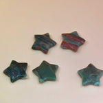 Crystal Gemstone Stars on pale orange background