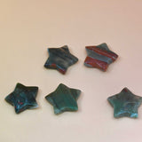 Crystal Gemstone Stars on pale orange background