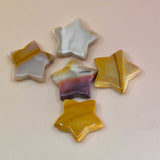 Crystal Gemstone Stars on pale orange background