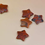 Crystal Gemstone Stars on pale orange background