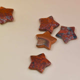 Crystal Gemstone Stars on pale orange background