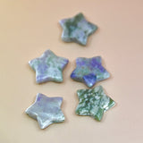 Crystal Gemstone Stars on pale orange background