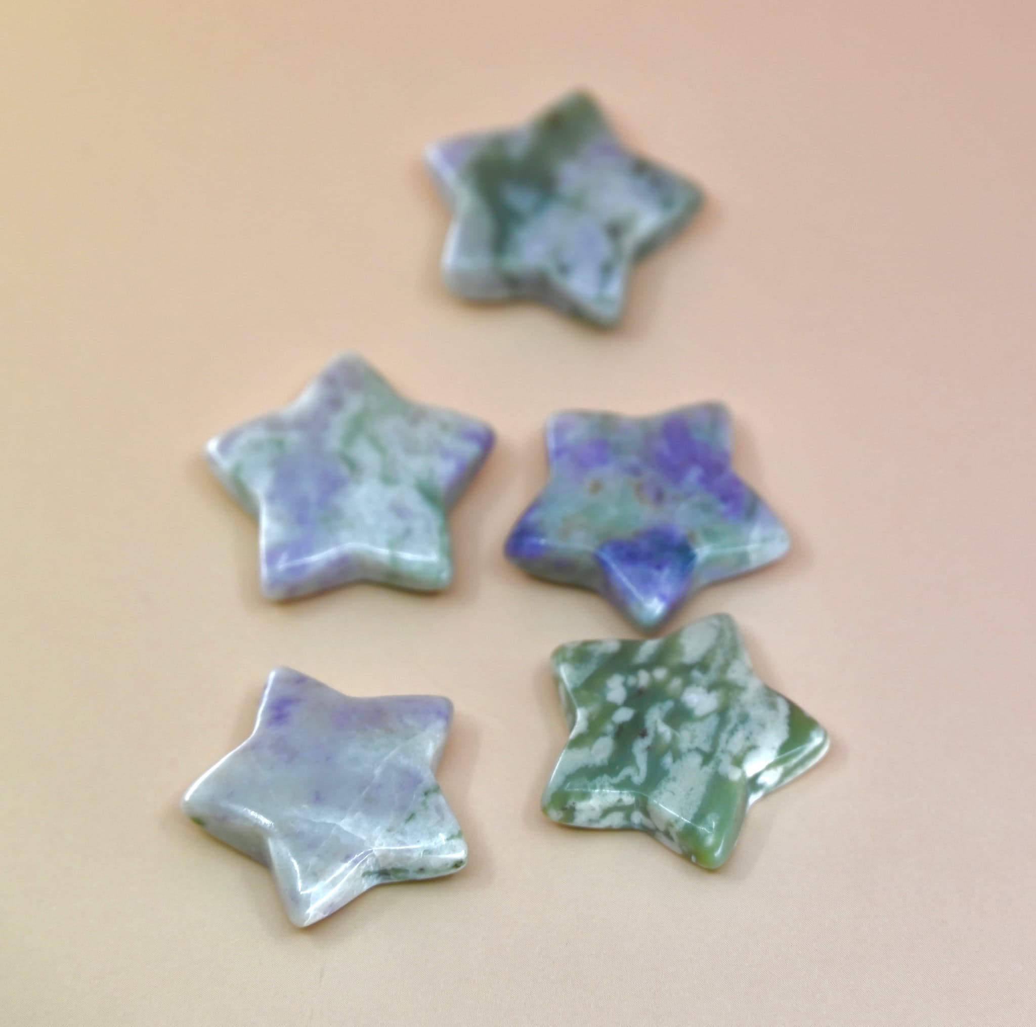 Crystal Gemstone Stars on pale orange background