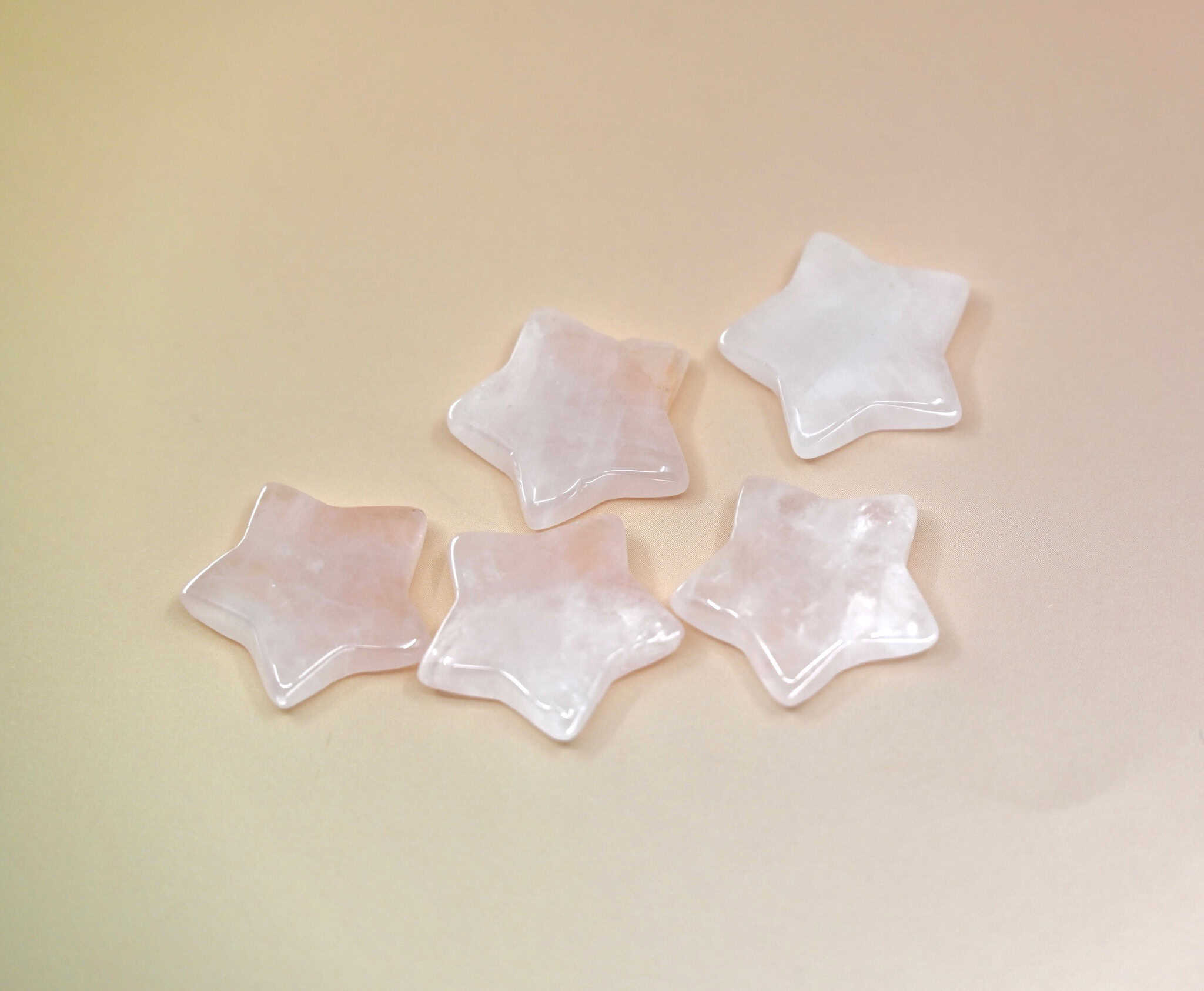 Crystal Gemstone Stars on pale orange background