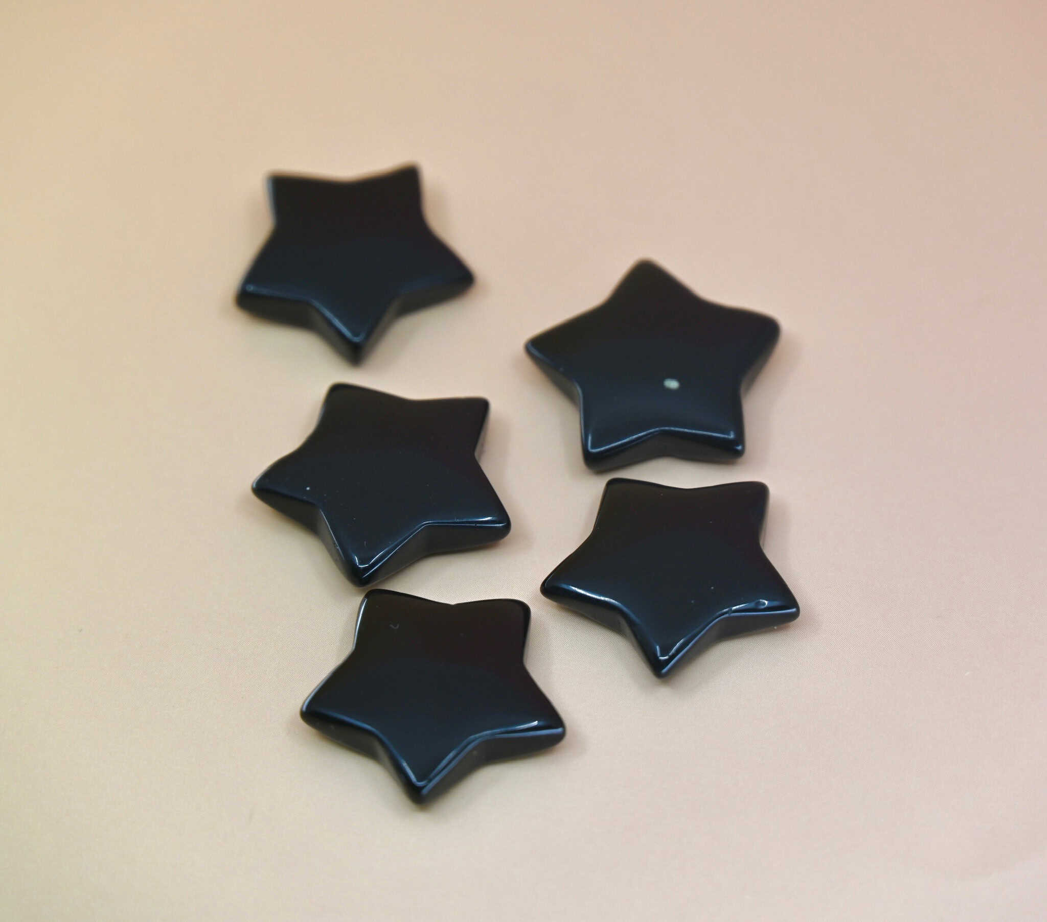 Crystal Gemstone Stars on pale orange background