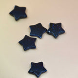 Crystal Gemstone Stars on pale orange background