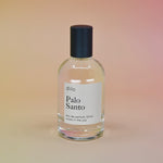 The Dilo Palo Santo 50ml Unisex Eau de Parfum on a light pink background.