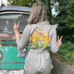 Person wearing a jacket with a 'Grateful Dead' backpack in front of a vintage van.