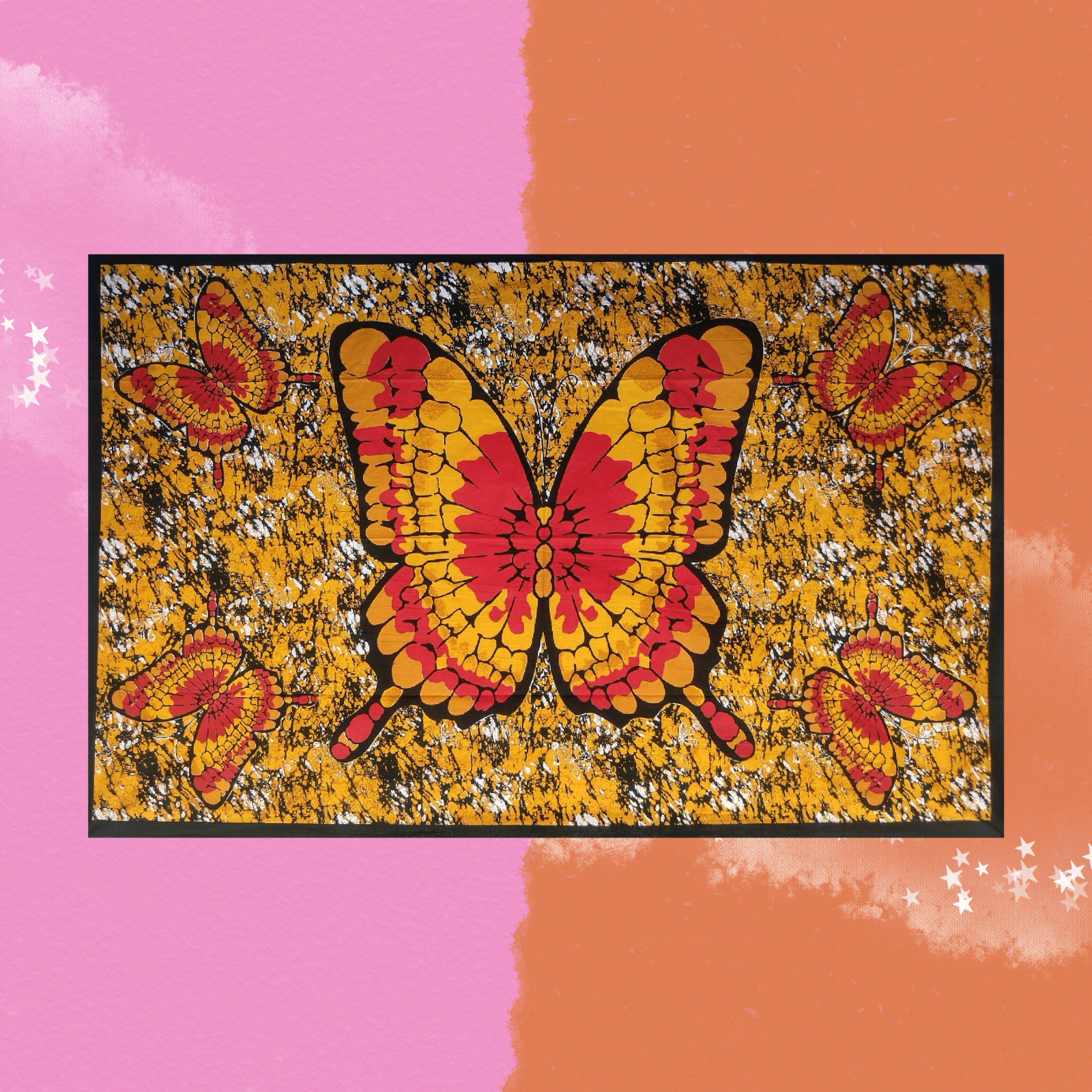 The Golden Butterfly Cotton Tapestry on a pink and orange background.