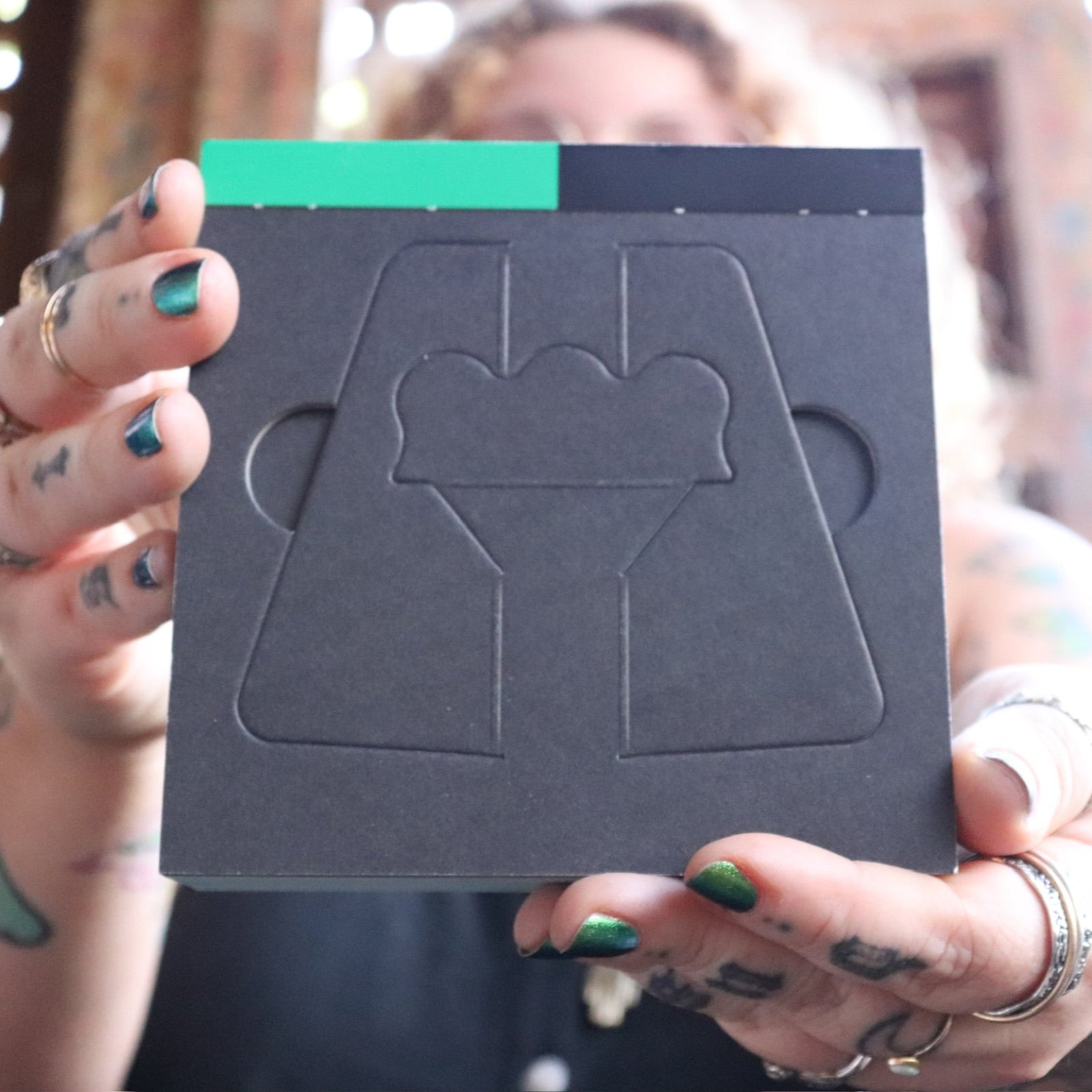 Someone holding the 2026 Witch's Calendar Daily Magick Day-to-Day Calendar.