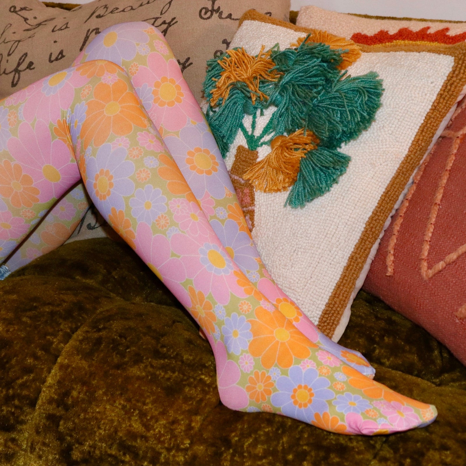 Someone wearing the Retro 1960s Pink & Green Flower Power Tights.