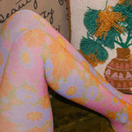 Someone wearing the Retro 1960s Pink & Green Flower Power Tights.