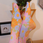 Someone wearing the Retro 1960s Pink & Green Flower Power Tights.