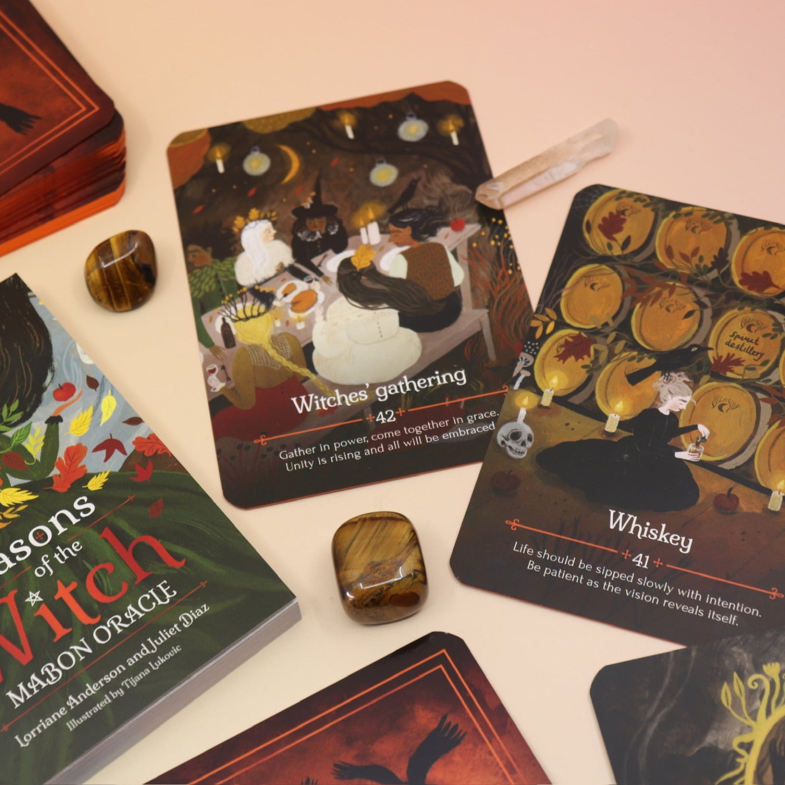 The Seasons of the Witch - Mabon Oracle Card Deck on a pink and yellow background.