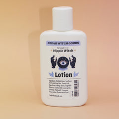 The Hippie Witch Body 4 oz Lotion on a pink and yellow background.
