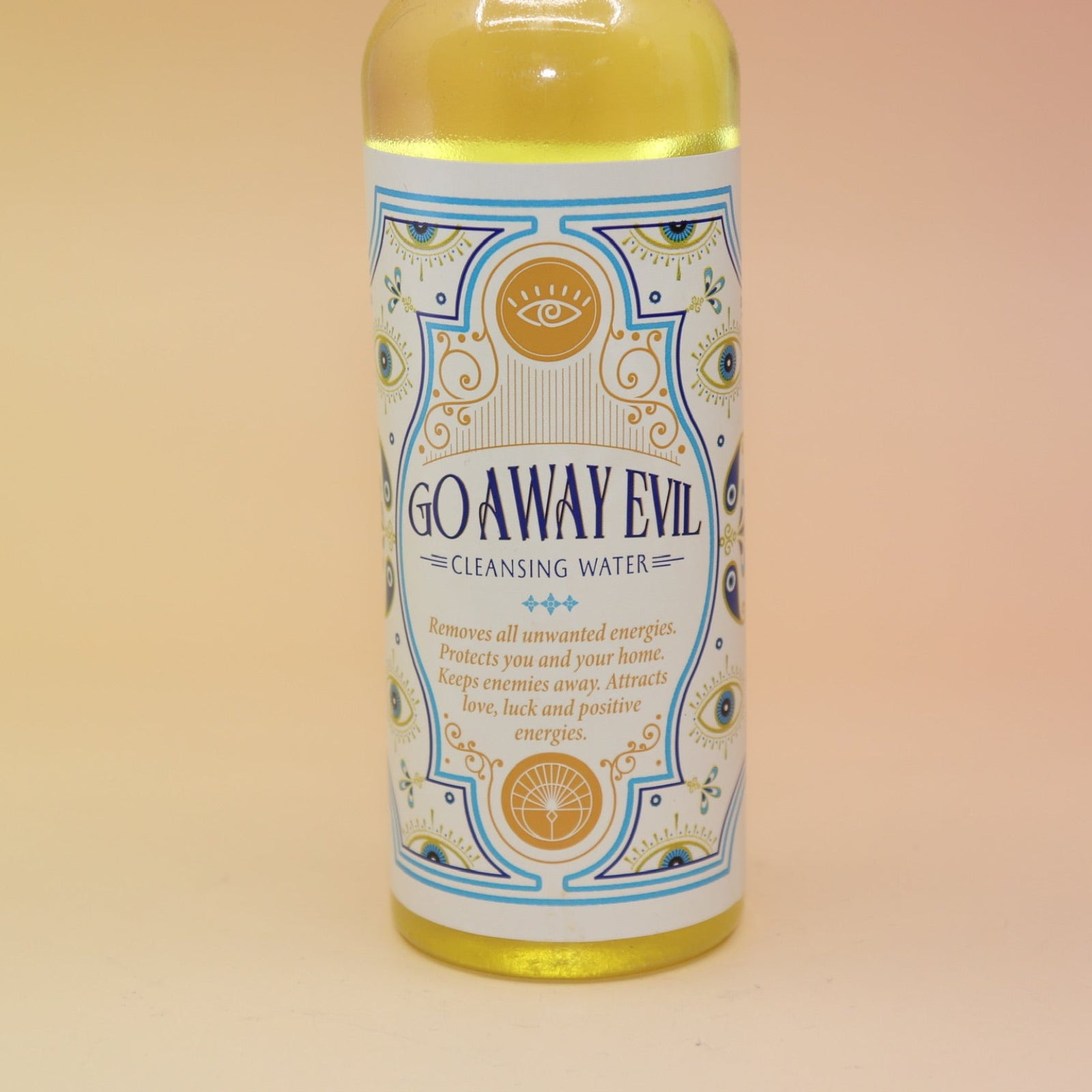An up-close image of the Go Away Evil Spiritual Cleansing Water 7.5 oz on a pink and yellow background.