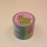 The Colorful Bunnies Washi Tape on a pink and yellow background.