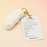 The Lucky Rabbit's Foot on a pink and yellow background.