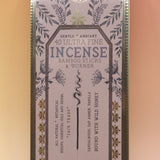 The Soft Sunset Premium Incense on a pink and yellow background.
