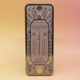 The Soft Sunset Premium Incense on a pink and yellow background.