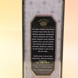 The Center Peace Premium Incense on a pink and yellow background, showing of the back.