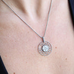 Someone wearing the Morgana's Spell Sterling Silver Necklace with a black top.