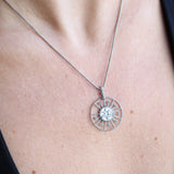 Someone wearing the Morgana's Spell Sterling Silver Necklace with a black top.